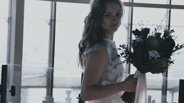 Beautiful Bride With A Bouquet In Hands