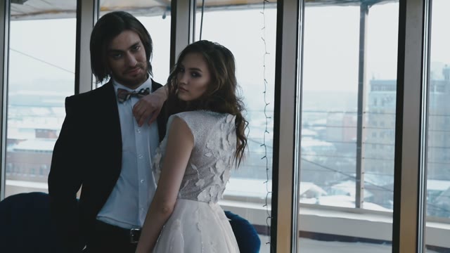 Bride And Groom Near The Window