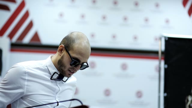 Speaker With Bow Tie Tells The Emotional Lecture