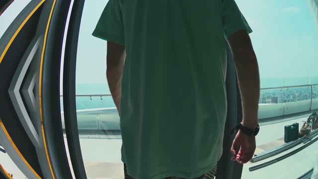 Man Steps Out Onto A Huge Balcony Close-up