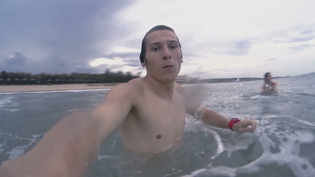 Man Is Covered By A Sea Wave Close-up