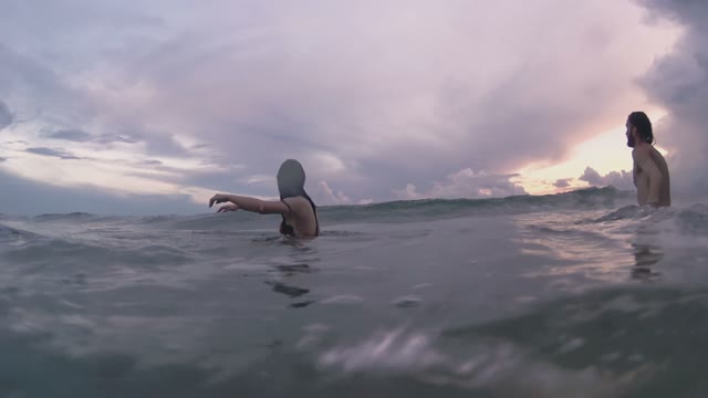 People Is Covered By A Sea Wave Close-up