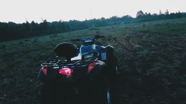 The Guy Jumped On The ATV In The Light Of The Evening