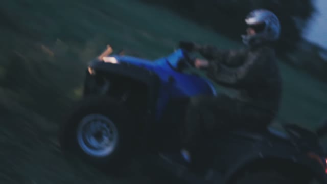 The Boy Went On A Blue ATV On Potholes