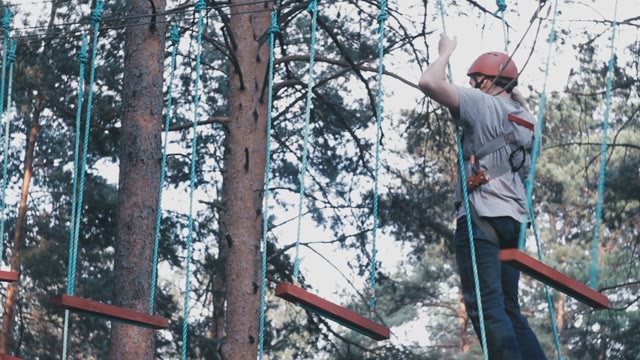 Man Tightrope Walker Overcome Obstacles In The Form Of A Ladder
