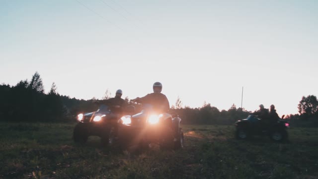 The Guys On The Quads Are In The Forest And Shine The Lights Into The Camera