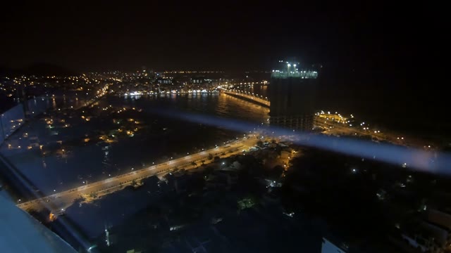 View Of The Night City And The Sea