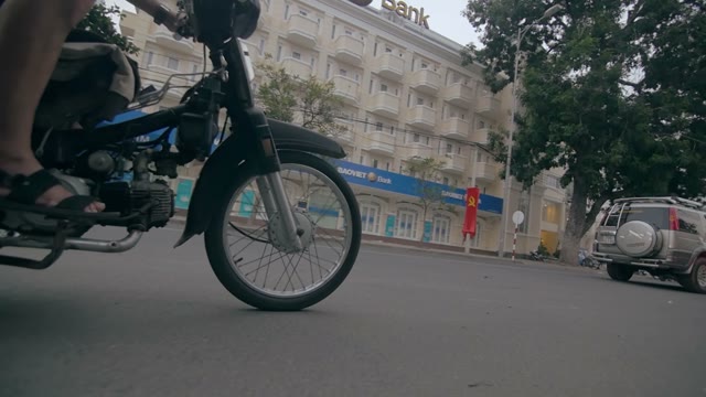 Man Rides Moped Close