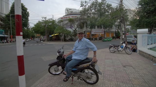 Man Sitting Moped