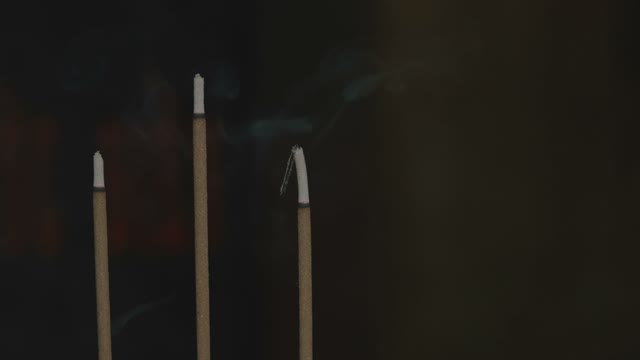 Smoldering Incense Sticks Close-up