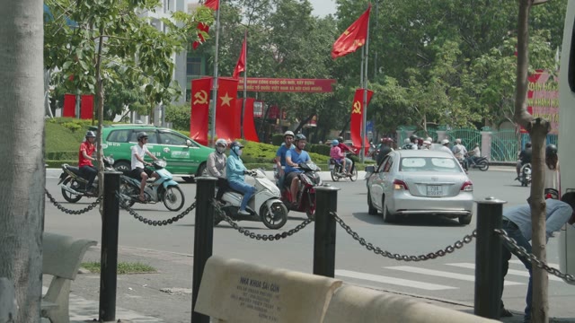 People Riding Mopeds
