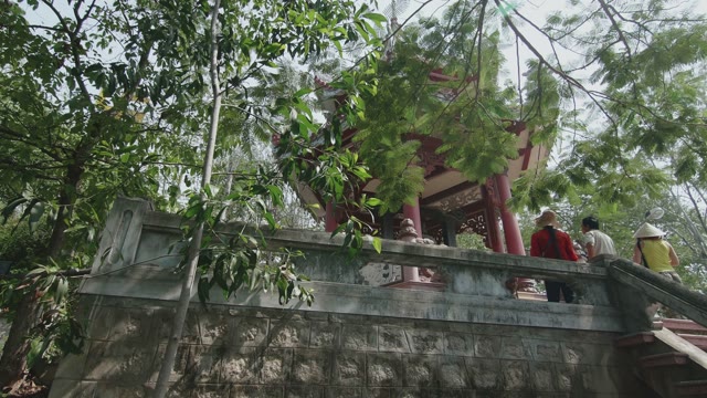 Tourists Gathered About Place With A Bell