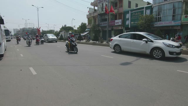 People Riding Mopeds