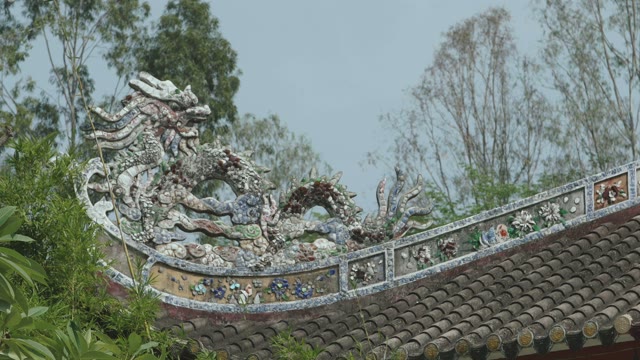 Sculpture Of A Dragon On The Roof Close-up