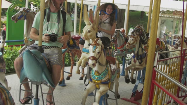 Guys Ride The Carousel And Filmed