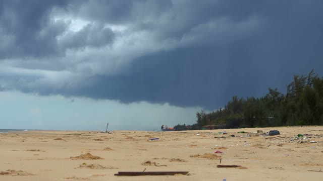 Dirty Sand Beach After A Storm During A Cloudy Day