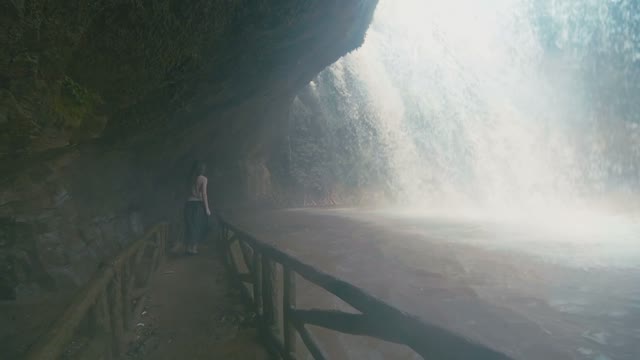 Girl Behind Waterfall