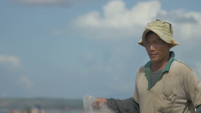 The Man Twists His Fishing Net
