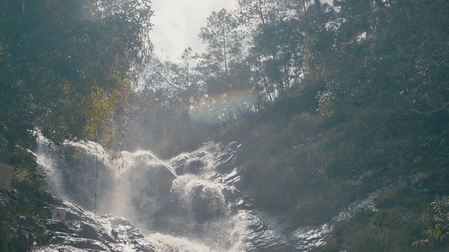Beautiful Waterfall Among The Greenery