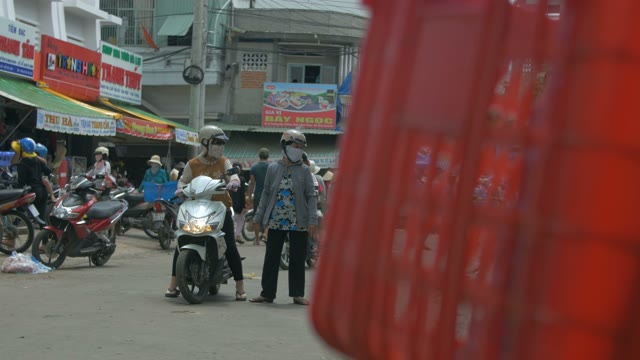 Asian Road Full Of Masked Men On Motorcycles