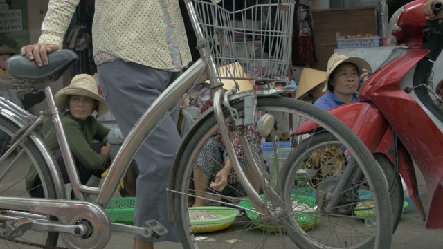 Asian Women Selling Fresh Fish On The Market