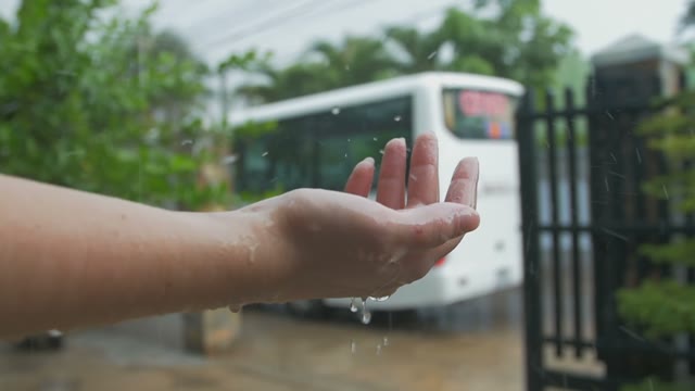 Raindrops Beat Womans Hand