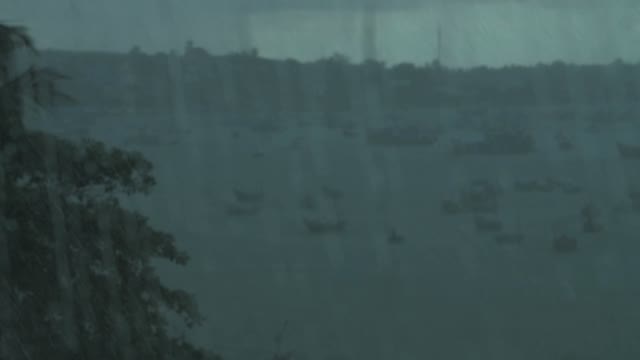 Raindrops On Car Glass On The Background Boat On A Mooring