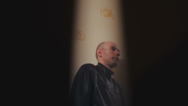 Bald Man Through Keyhole