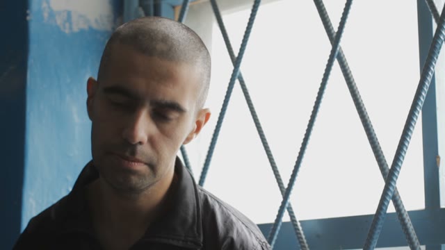 A Prisoner Sitting At The Gate