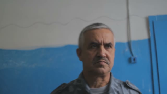 Portrait Of A Formidable Gray-haired Policeman