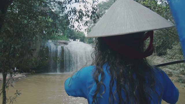 Girl On The Background Of A Small Waterfall