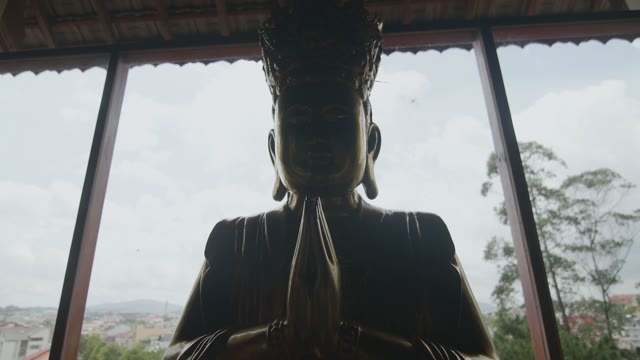 Silhouette Of A Buddha In A Temple Close-up