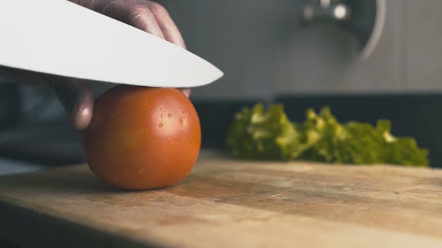 Chef Is Cutting A Tomato Close-up