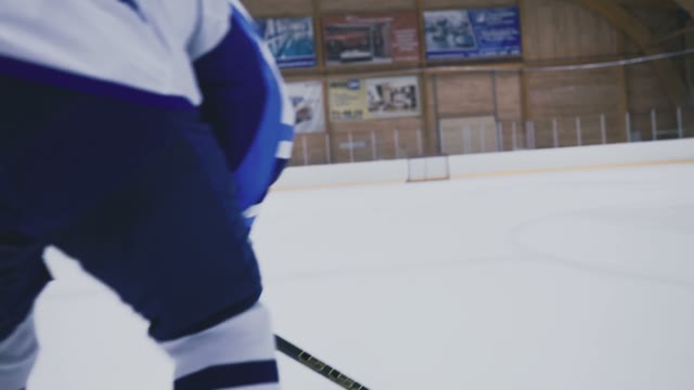 Hockey Player Takes Away Puck