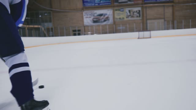 Hockey Player Takes Away Puck