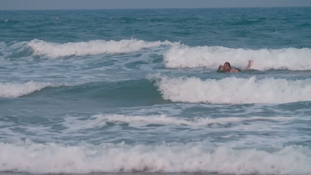 Young Slim Guy Learns Surf