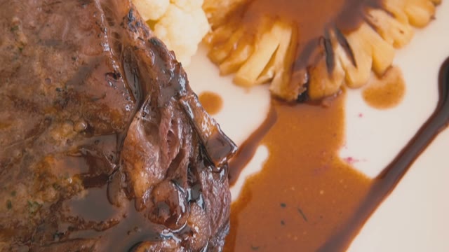 Appetizing Steak With Vegetables And Gravy