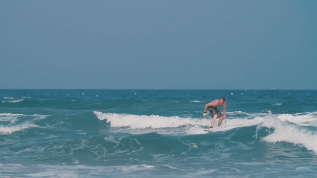Young Guy Learns Surf