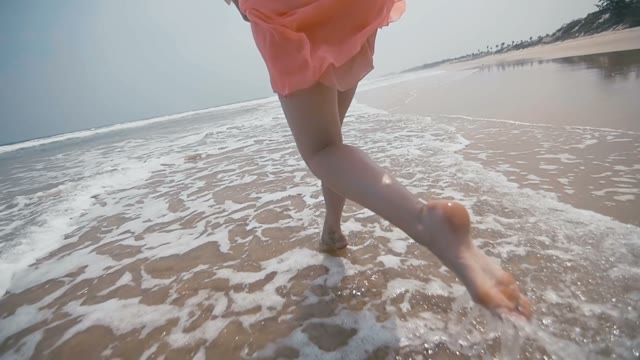 Charming Young Girl Walking On The Beach