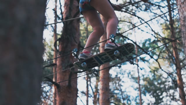 Girl Scrambles Over An Obstacle