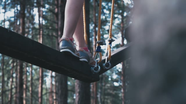 Girl Scrambles Over An Obstacle Close-up