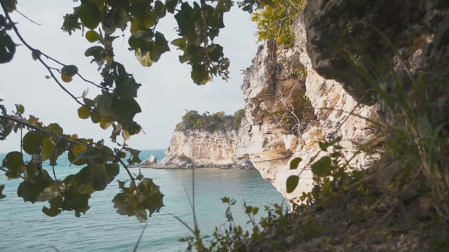 Sea Waves Are Slowly Breaking Up On A Rocky Terrain
