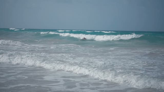 The Surfer Is Trying To Climb The Wave