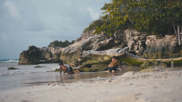 Child Playing On The Beach