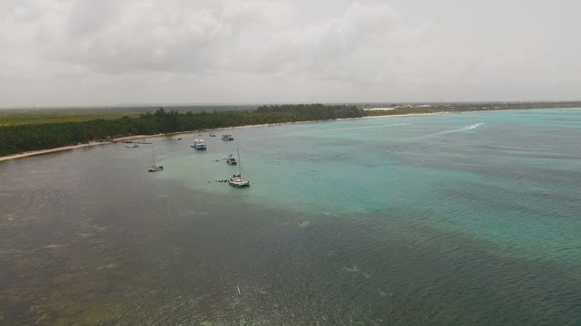 People Bathe In The Sea And Rest On Yachts