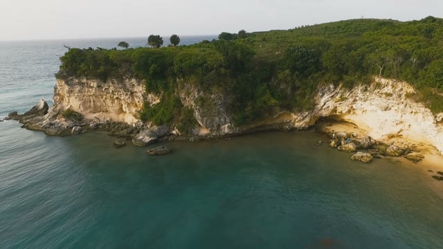 Beautiful Rocky Terrain Covered With Grass And Gorgeous Blue Sea
