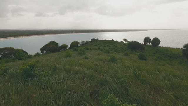 Beautiful Grassy Hill And Steep Cliff