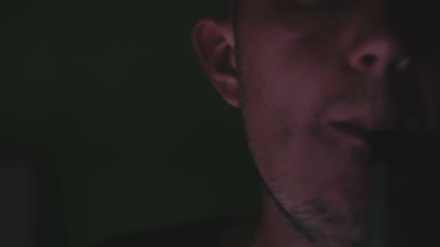 Man Exhales Smoke From A Hookah Close-up