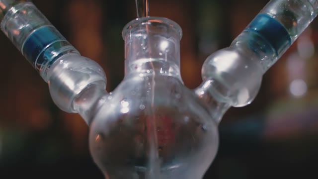 Water Pours Into A Hookah Close-up