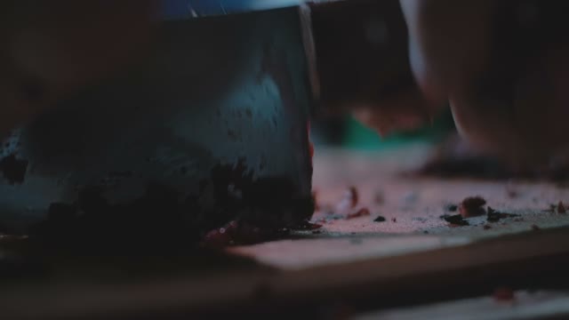 Man Chopping Something With A Knife Close-up